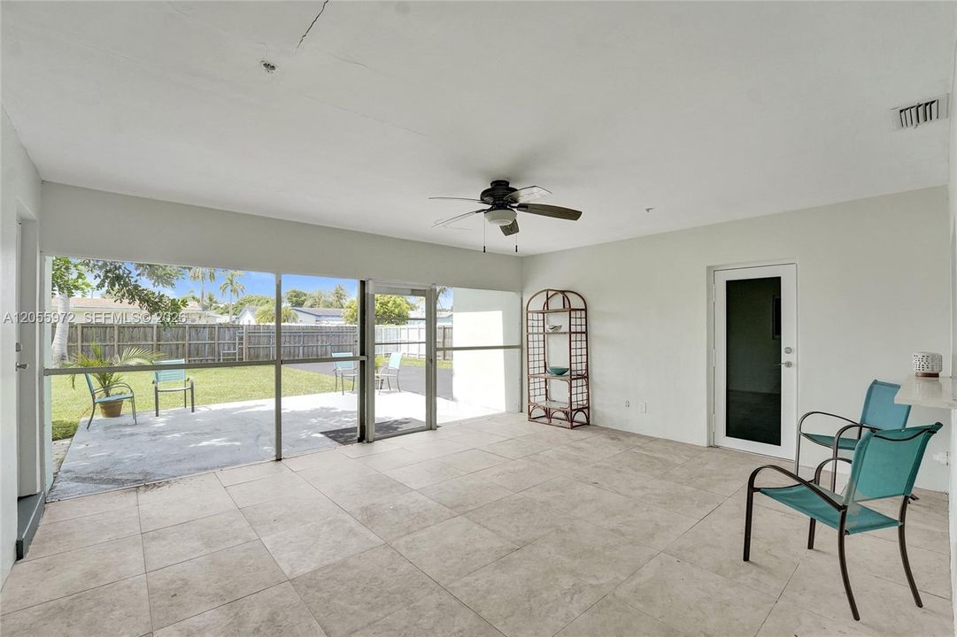 Screened in tiled patio
