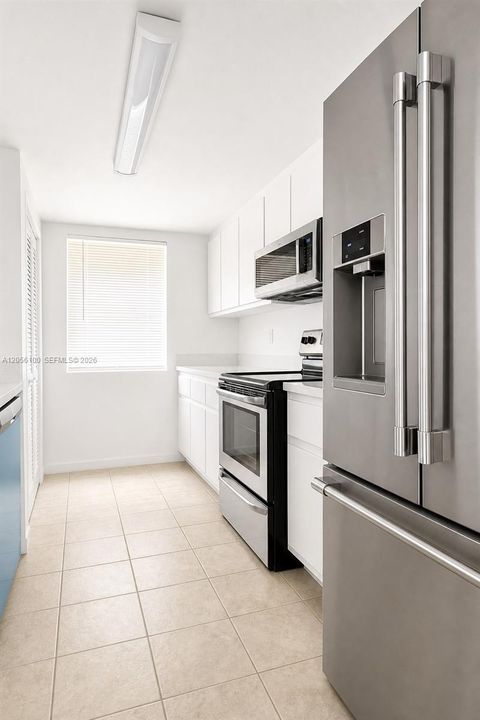 bright kitchen with new appliances and tons of storage and countertops