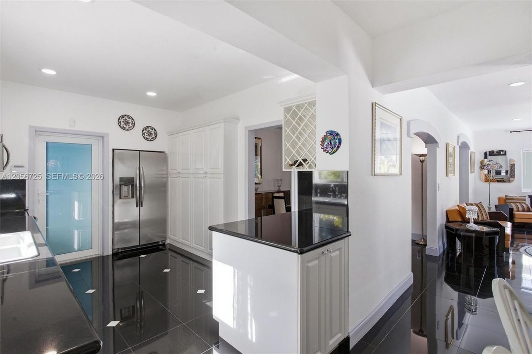 White Laquer cabinets, granite countertops w/ Build in Pantry