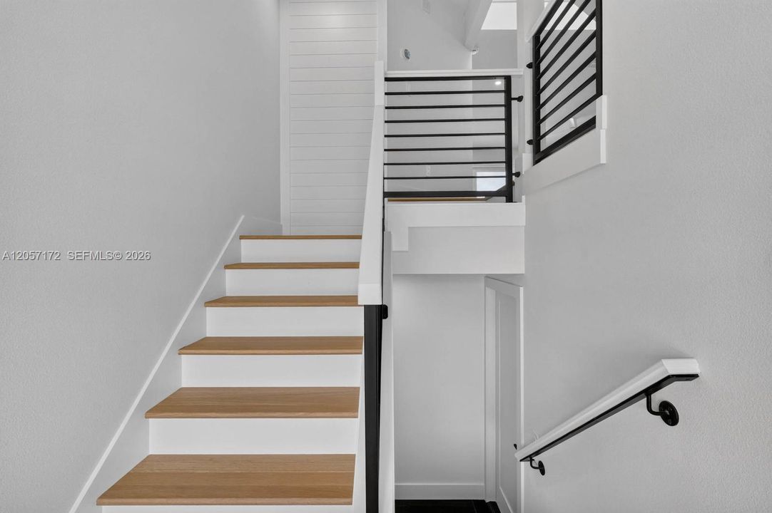 Inside, stairs to garage & main level of home