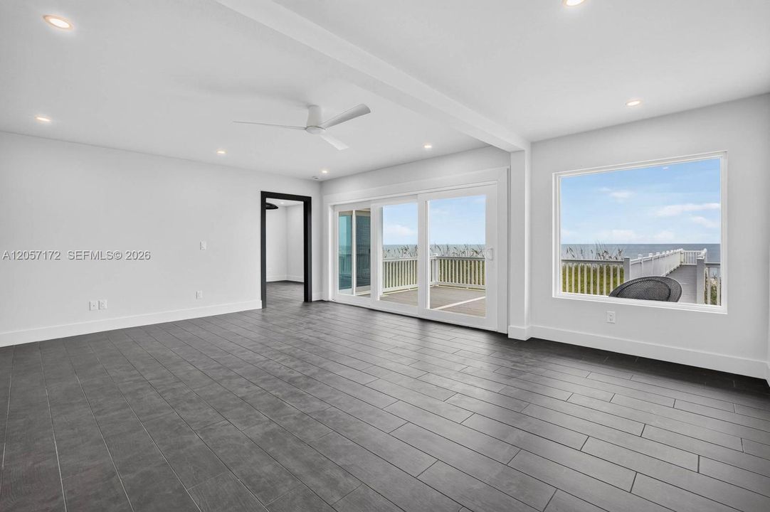 Living to main level bedroom with ocean view