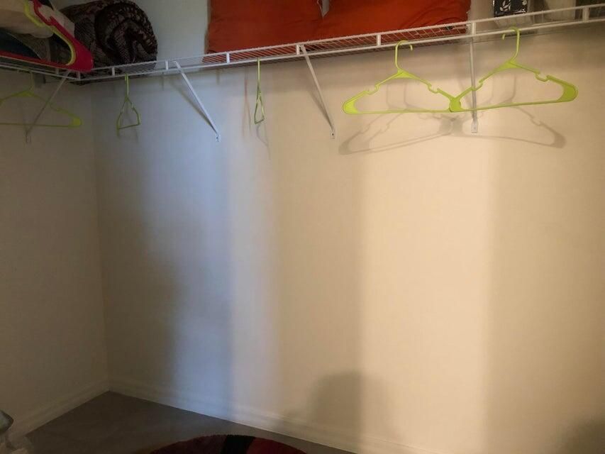 PhotoPrimaryWalkInCloset