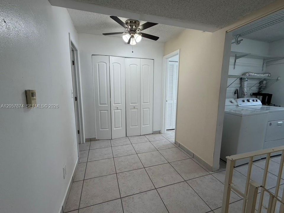 Upstairs to Utility/Laundry room and open landing with closet