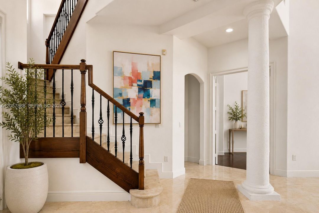 GRAND FOYER WITH A STAIRWAY TO NEW MEMORIES!