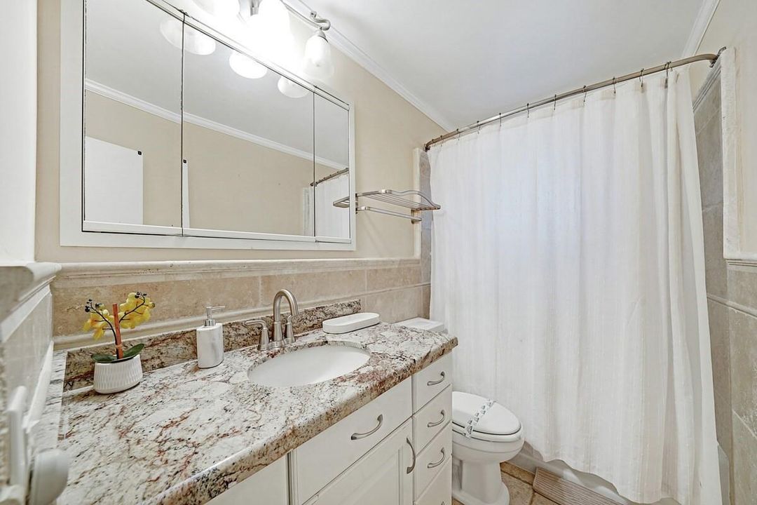 Bathroom with tuband shower.