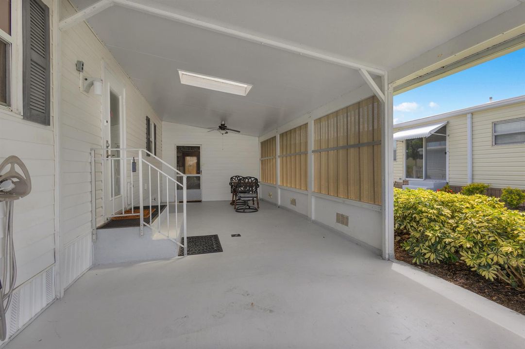 CARPORT WITH SKYLIGHT AND SHADE WALL