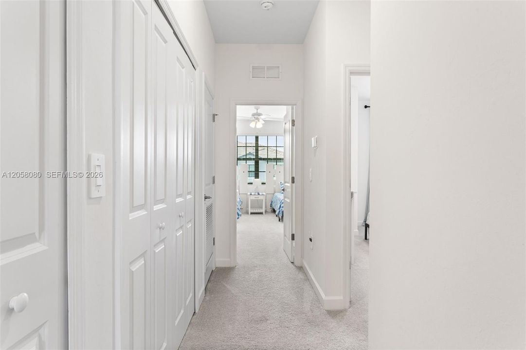 Bright upstairs hallway offering easy access to the bedrooms, bathrooms, and ample closet storage