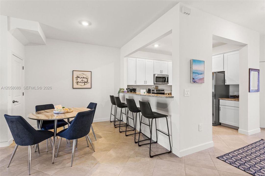 A versatile breakfast bar offers the perfect spot for casual dining or morning coffee