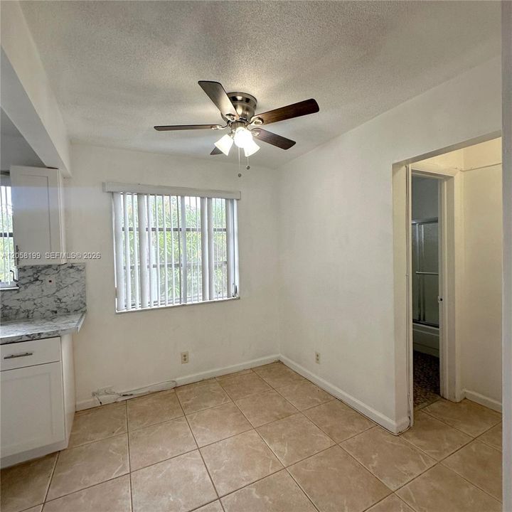 Formal dining room in front of kitchen. Bathroom is located to the right.