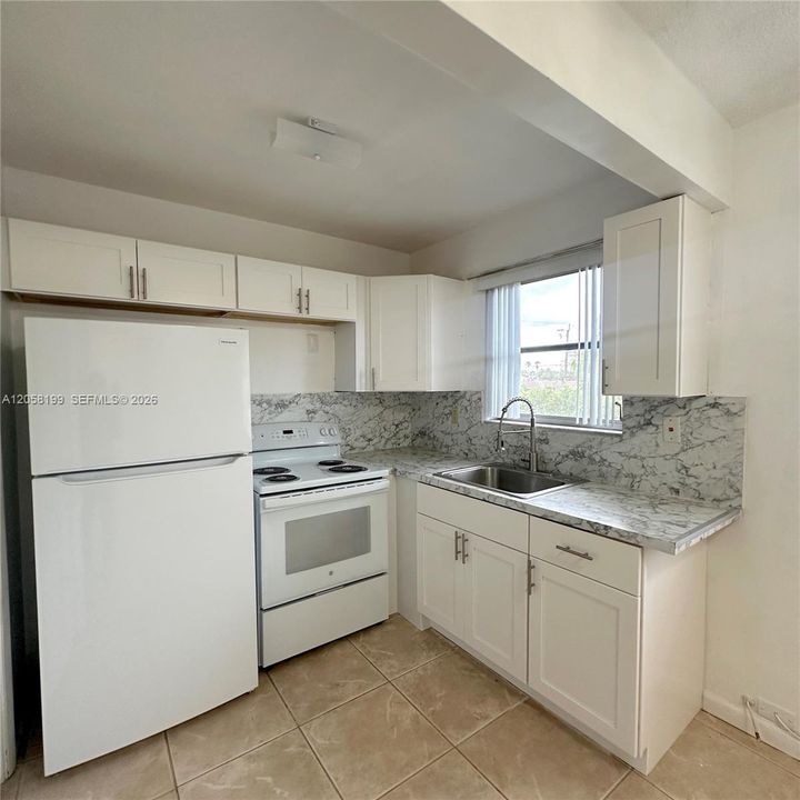 Refrigerator 1 yr old, stove 2 years old. Kitchen remodeled 2 years ago.