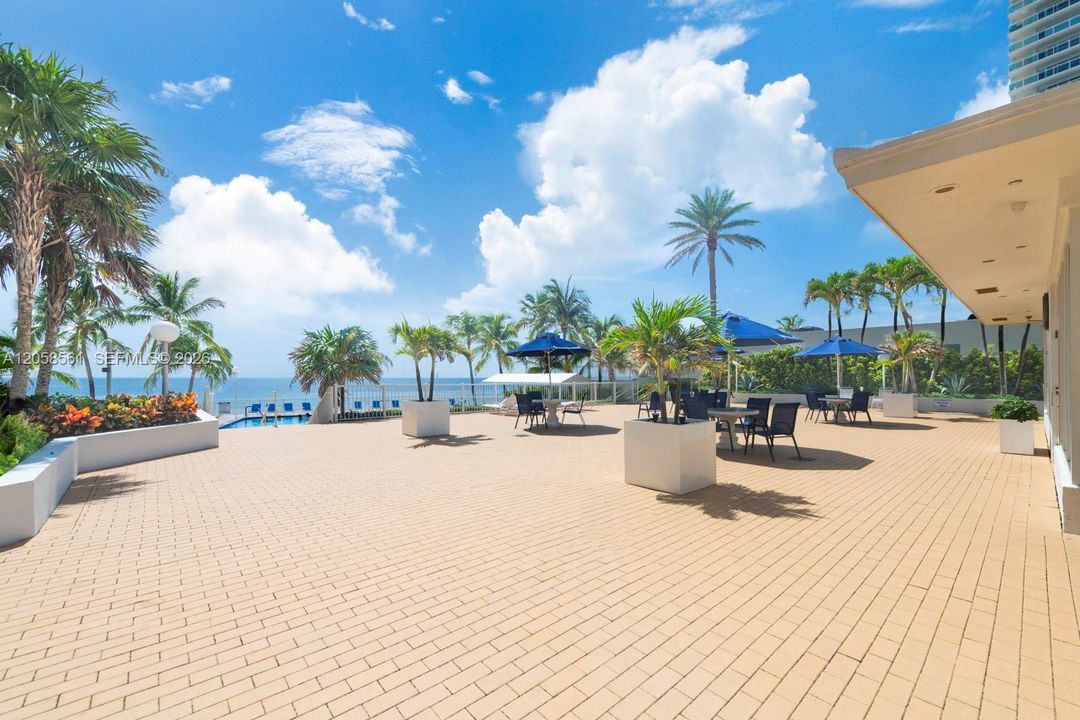 Open area with grills, tables and umbrellas