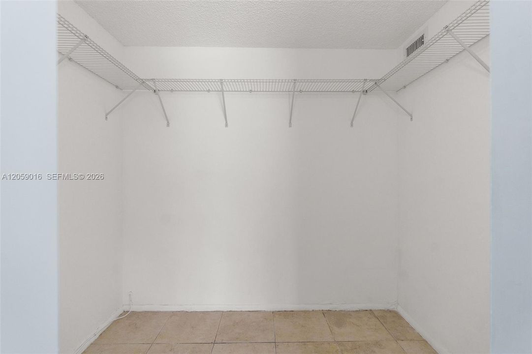 1 of 2 Walk-In Closets in Bedroom