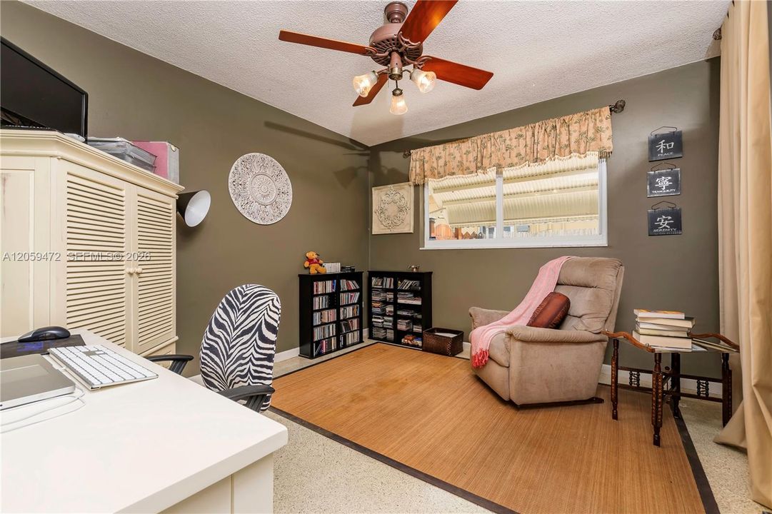 Well-sized second bedroom with ceiling fan and abundant natural light, ideal for guests, family, or a home office.  FYI - Some paint colors have changed since the last pictures.   Furniture, some lighting fixtures  & personal items not included in the rental. The house is now vacant. See vacant pictures below.