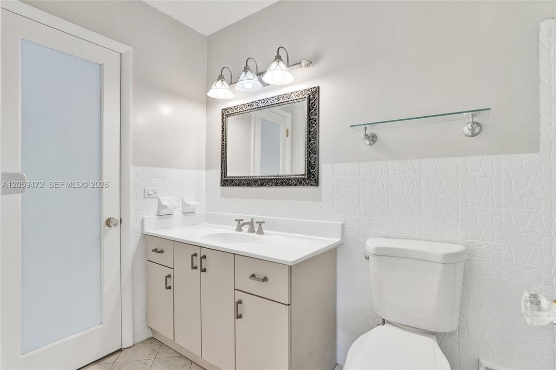 Recently updated second bathroom featuring modern fixtures and finishes.