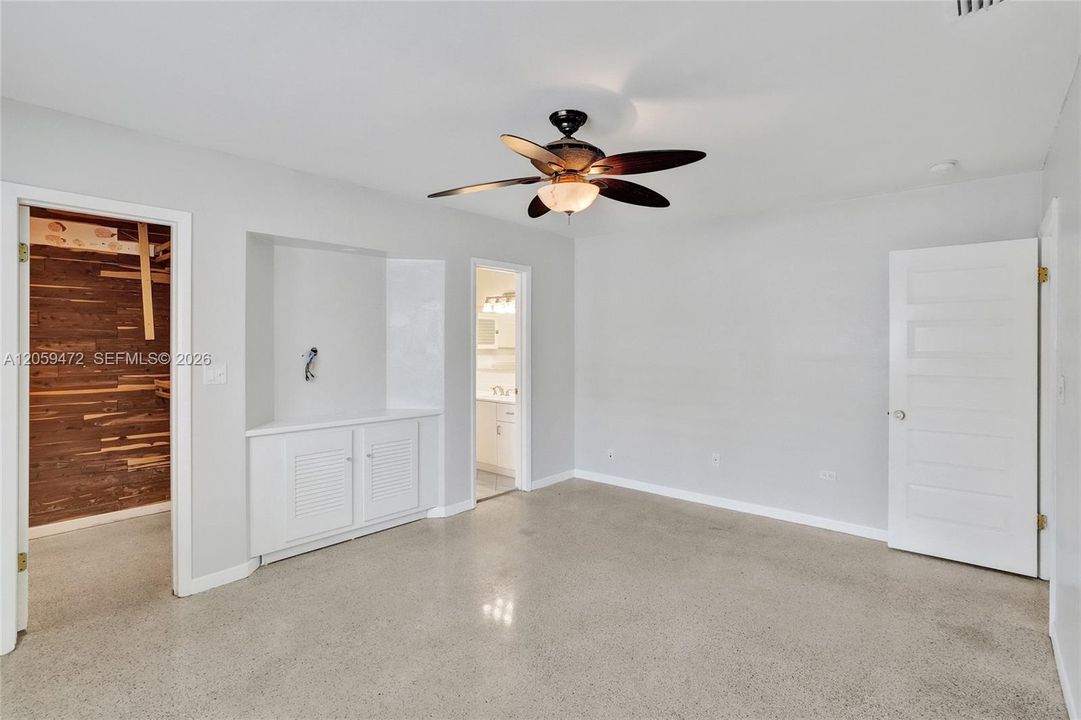 large master bedroom, cedar-lined closet, terrazo floors, and recently updated white bathroom