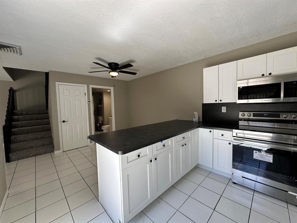 Dining, half bath, Laundry, Stairs