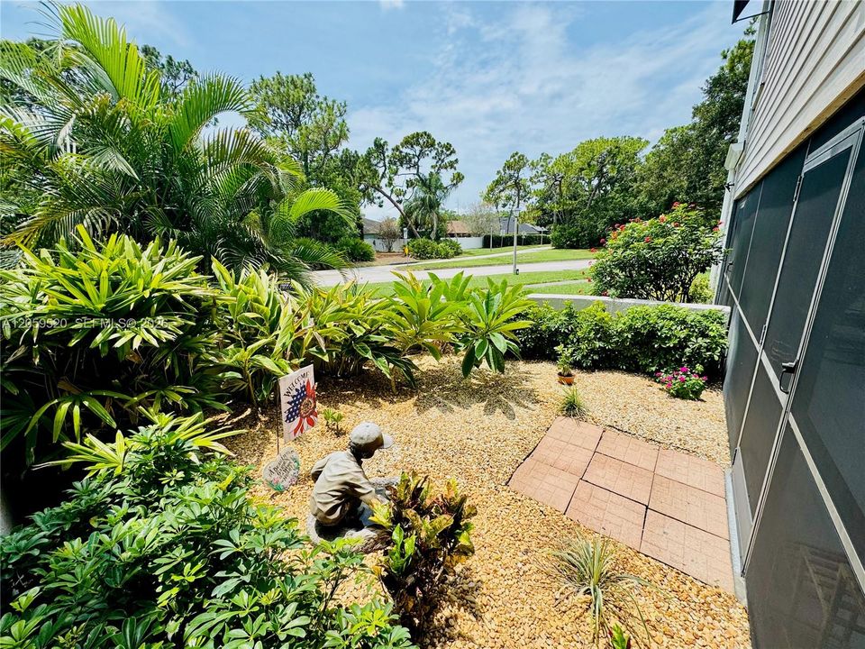 Your very own private garden area featuring palms and plumeria trees.