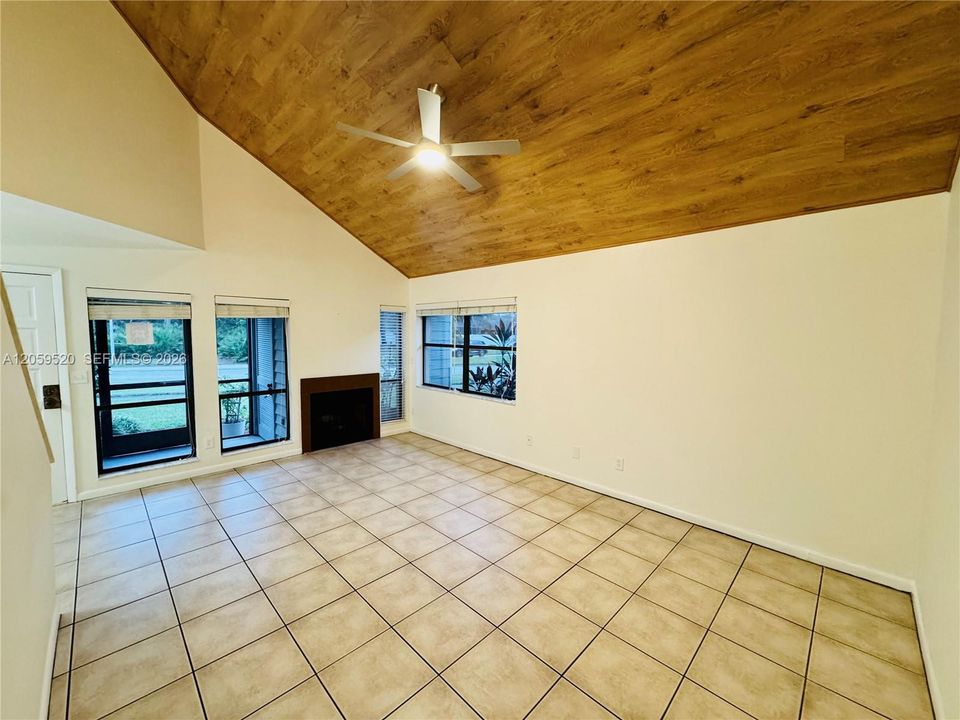 Living Room featuring corner windows with plenty of natural light