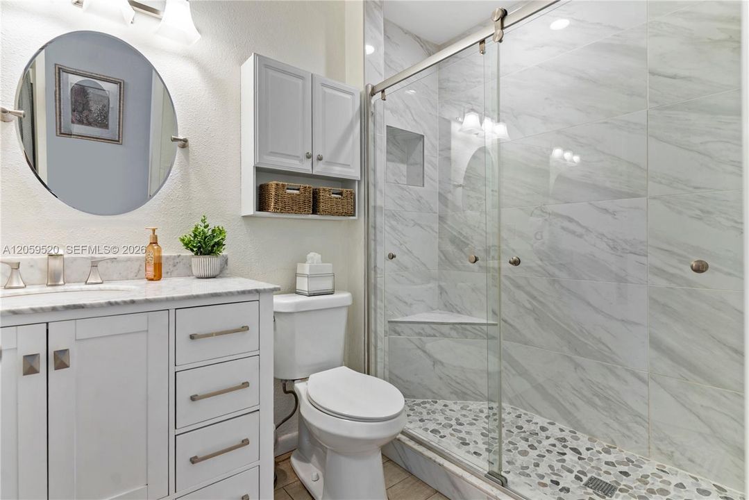 Beautifully updated bathroom with plenty of storage and walk in shower