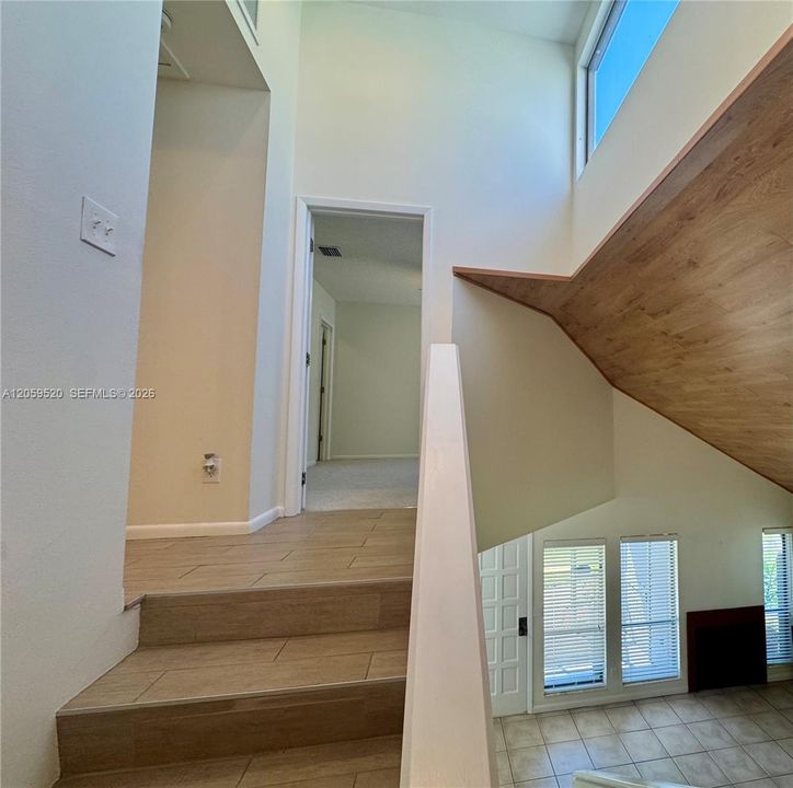 Stairway featuring a skylight