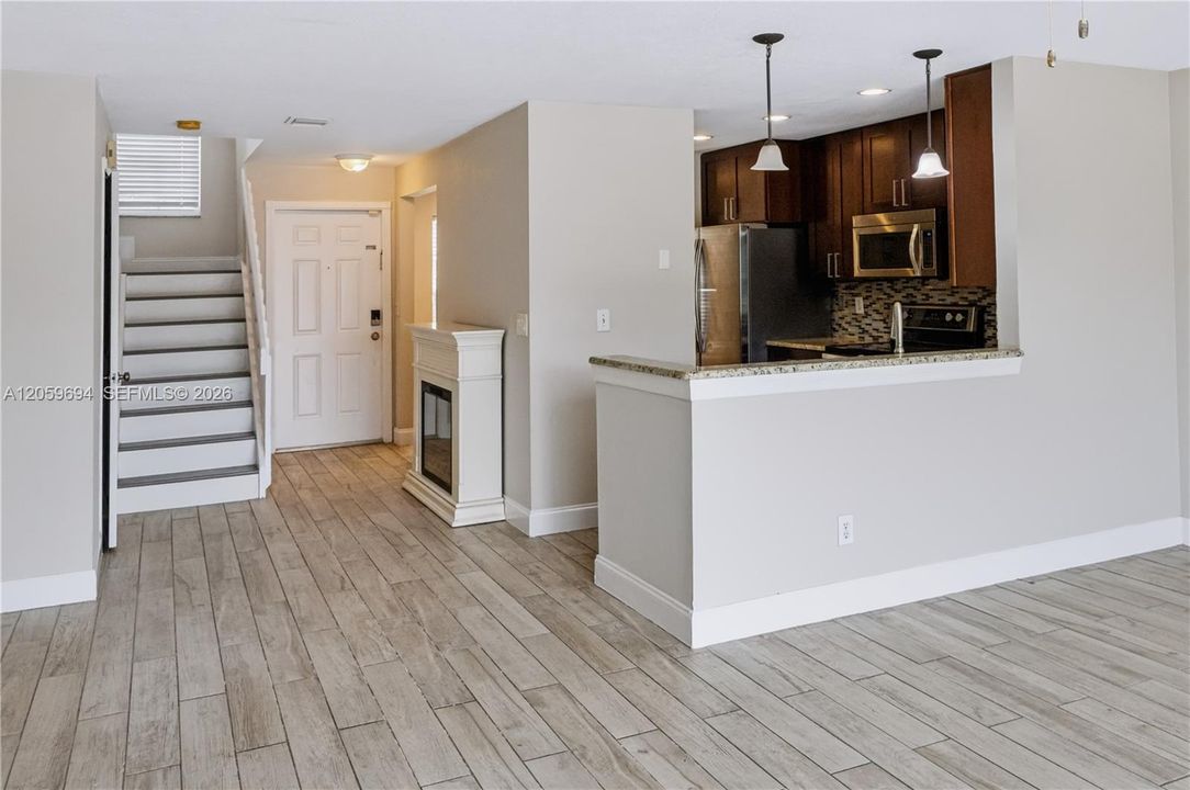 Entry, kitchen with breakfast bar, stairs
