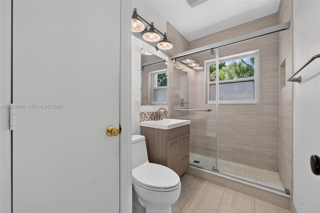 Hallway bathroom with shower