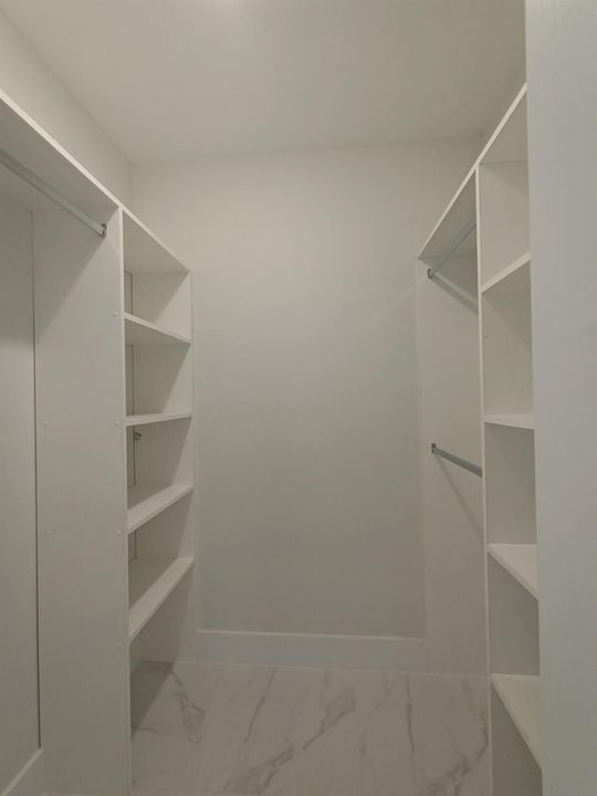 One of Two Custom Made Walk-In Closets