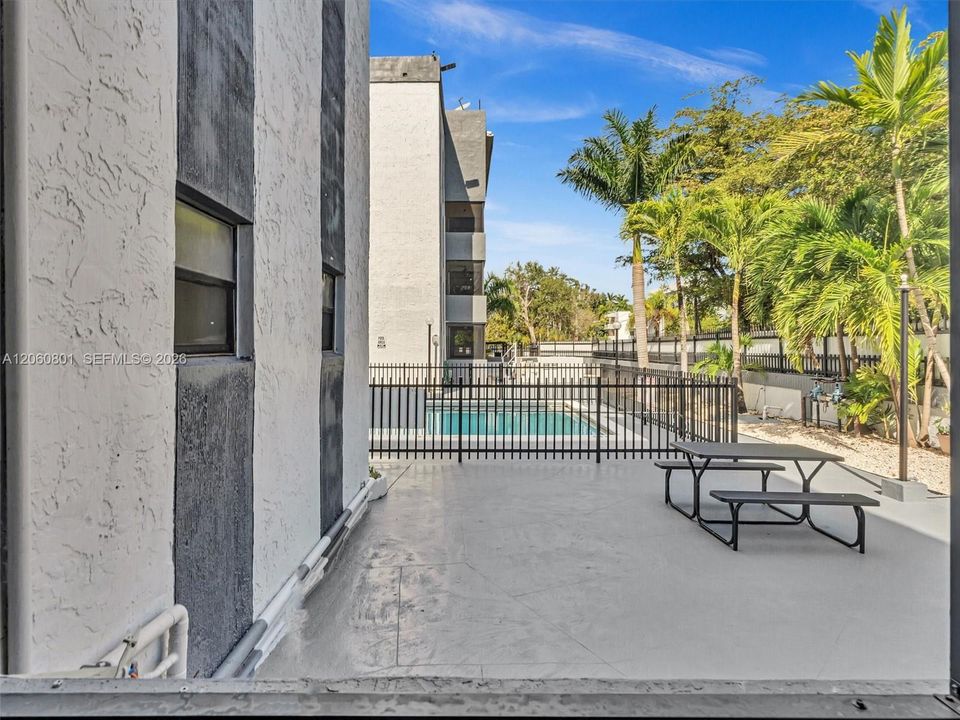 View of community pool grounds from patio
