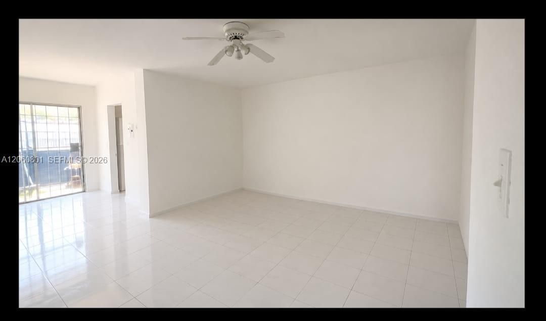 Open interior living space with tile floors