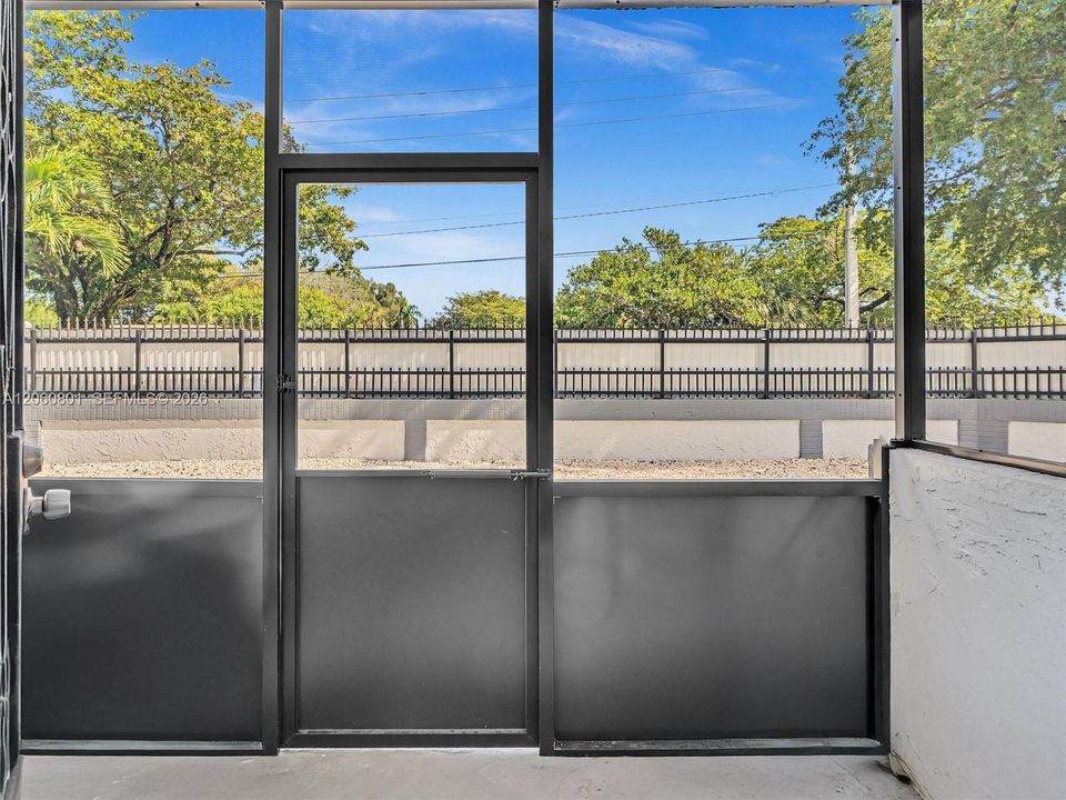 Screened porch with pool views