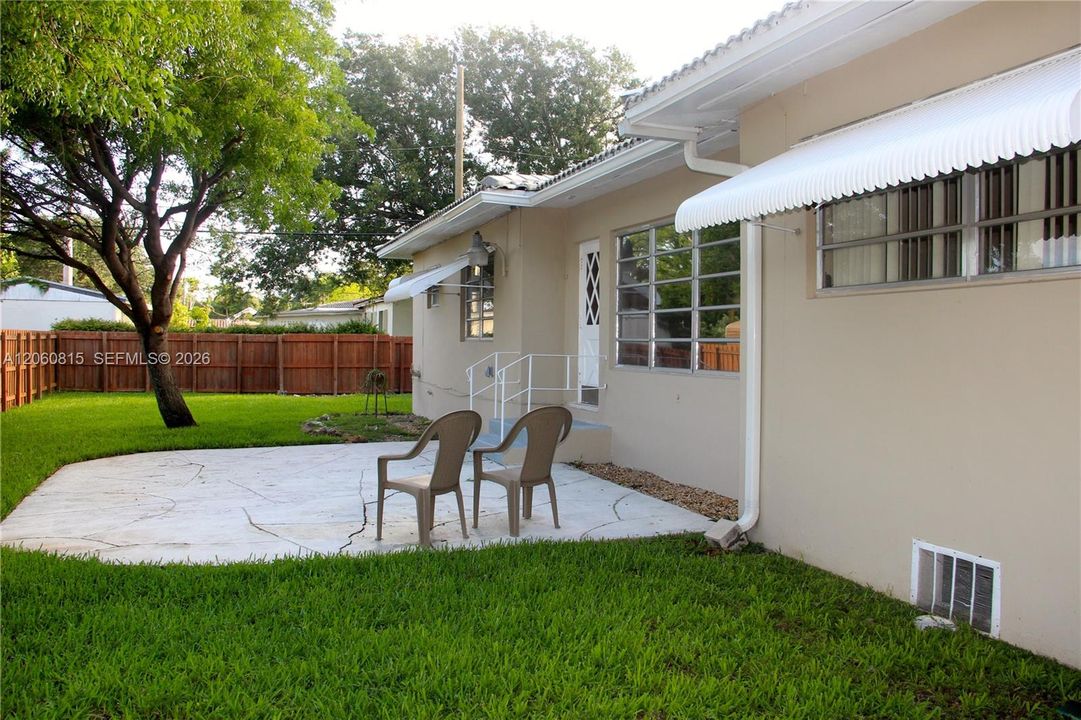 Large Fenced in Backyard Patio & Trees