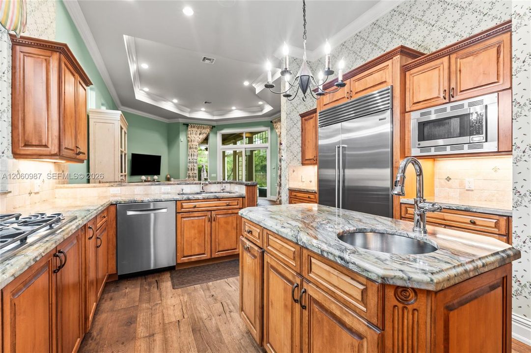 Updated kitchen with Fusion polished granite countertops and designer backsplash