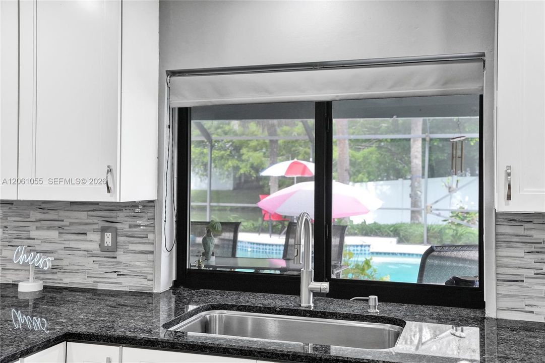 Kitchen window looking out to the pool