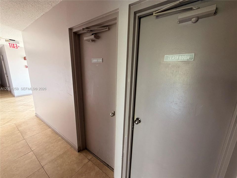 Laundry room infront of the unit front door.