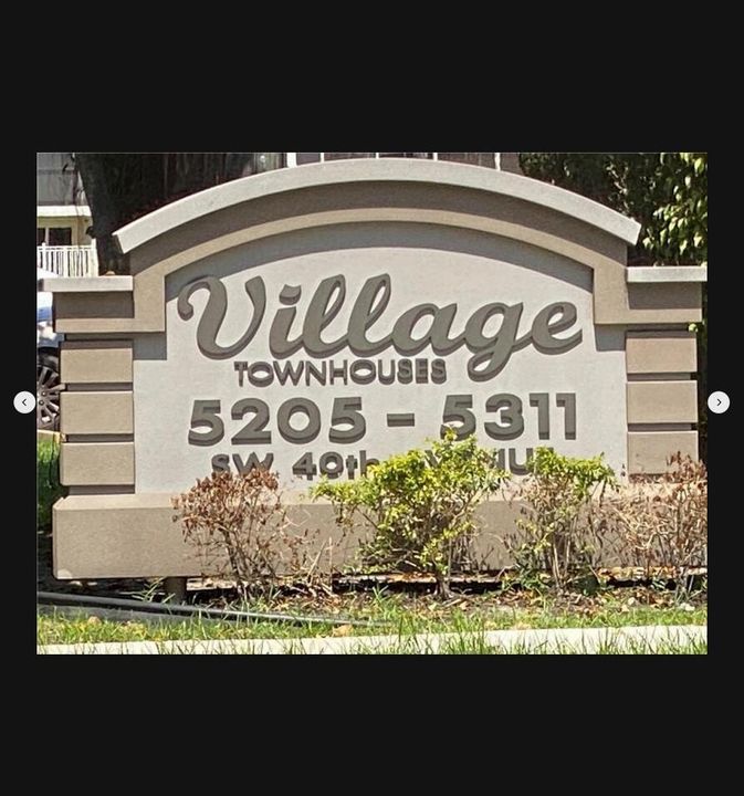 Village Townhouses Welcome Sign