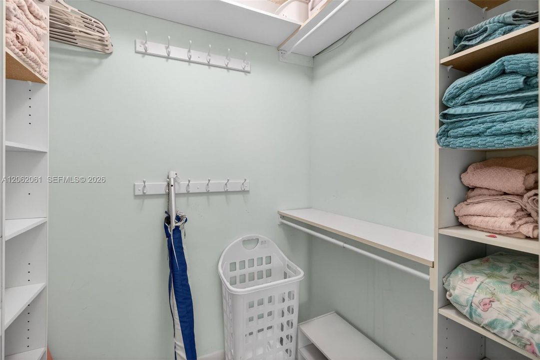 Generous walk-in closet in the primary bedroom offering extra storage along with towels, blankets, and convenient extras for a comfortable stay.