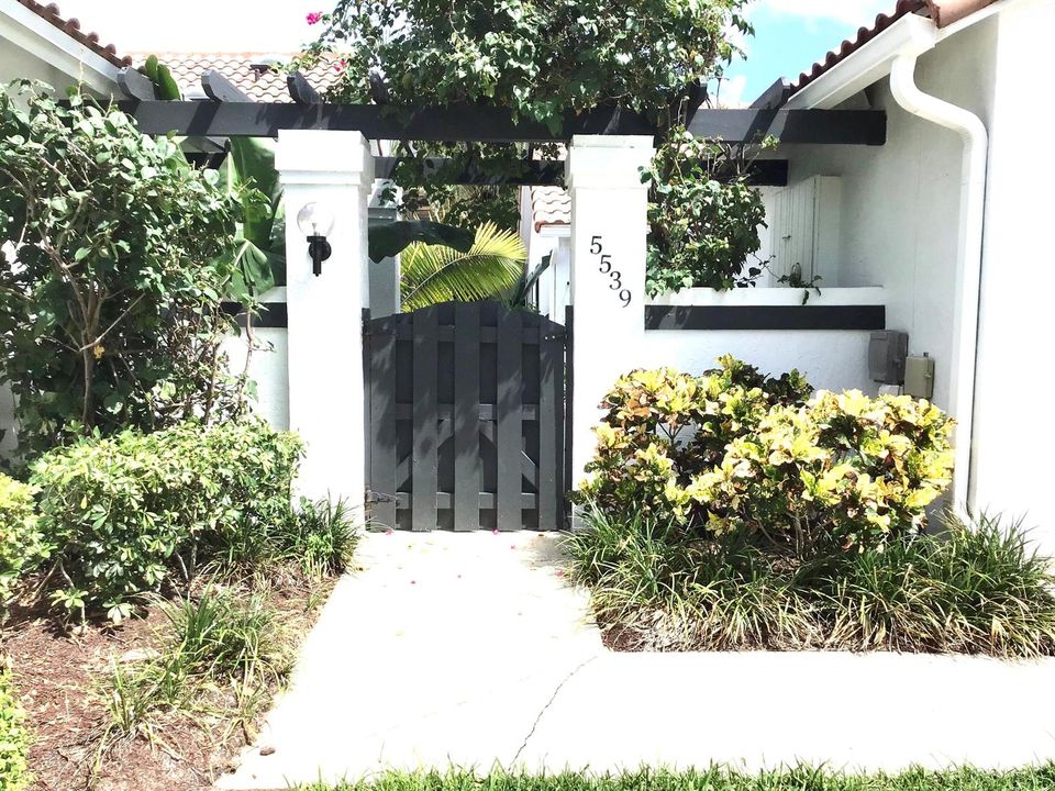 PRIVATE GATED ENTRY TO COURTYARD