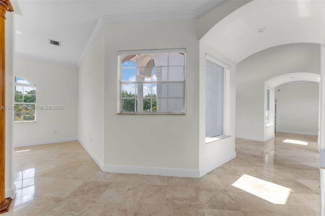 FOYER OPENS TO COURTYARD VIEW THEN ALL WRAPS AROUND AMAZING COURTYARD. THE LIVING AREAS ON ONE SIDE WITH BEDROOMS ON ANOTHER...