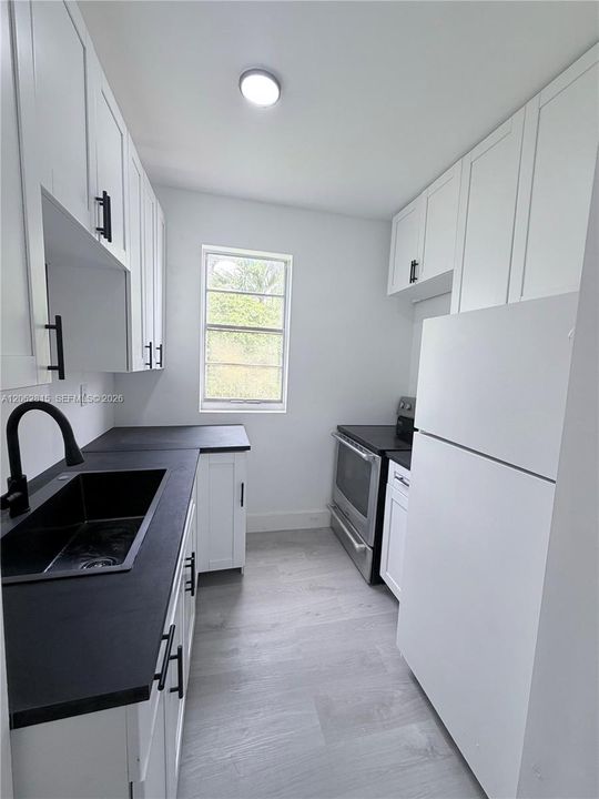 Stone showers and LED lighting throughout! Brand new Kitchen with black anodized sink! - never lived in!