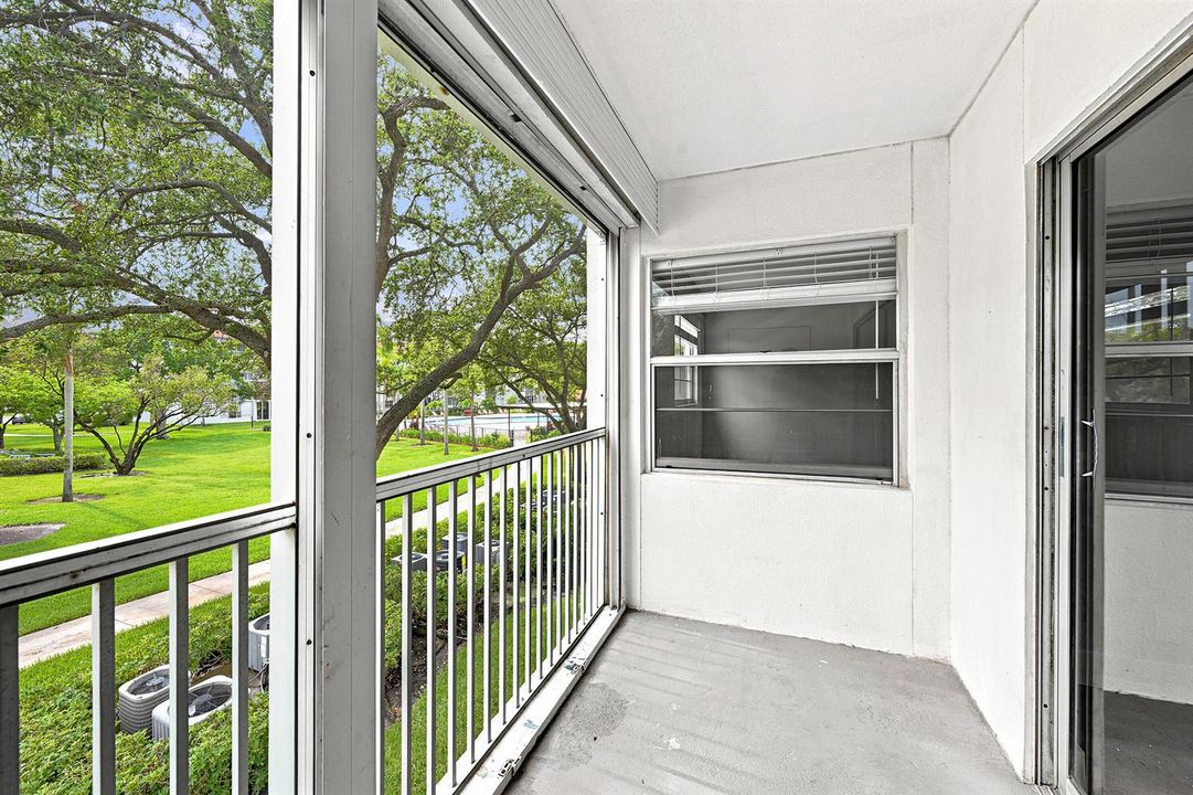 Screened Balcony with Pool Views