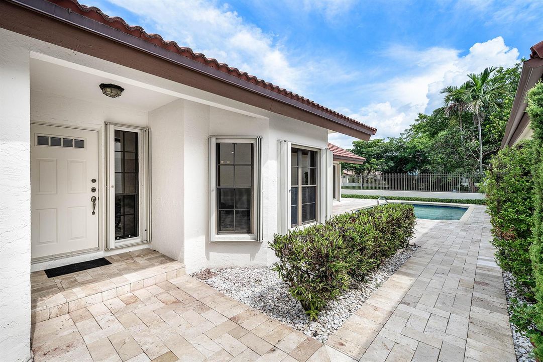 INVITING MARBLE PAVER COURTYARD ENTRY