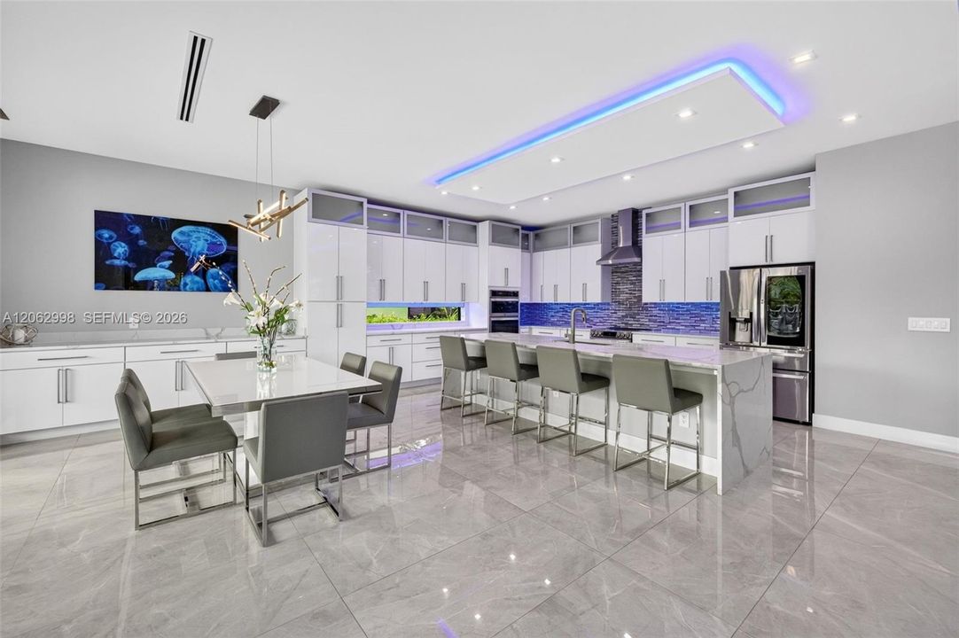 Chef's kitchen w/ counter seating, quartz waterfalls, 2 ovens, pot filler, tons of storage, KraftMaid cabinets