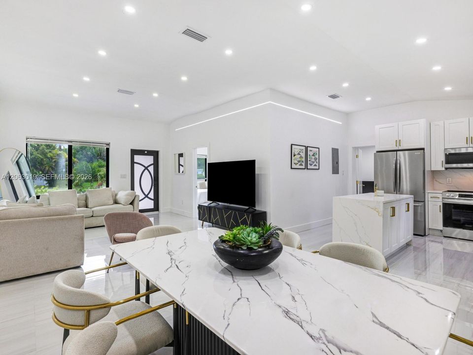 Open-Flow Living/Dining/Kitchen with Volume Ceilings