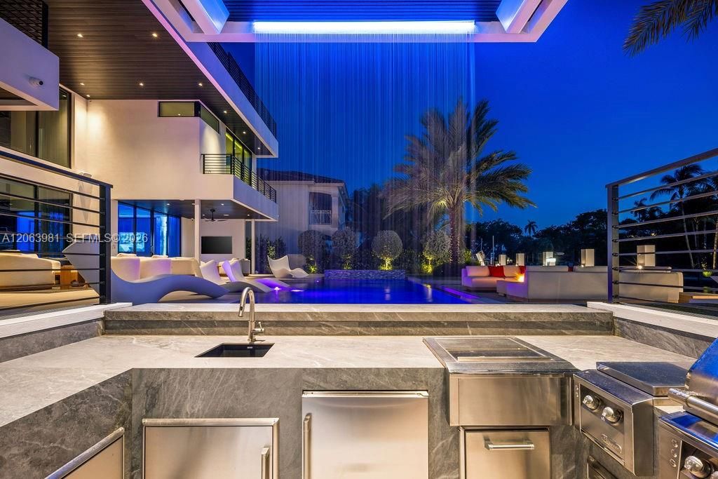 Your own resort: a gazebo, a waterfall, and a swim-up bar.