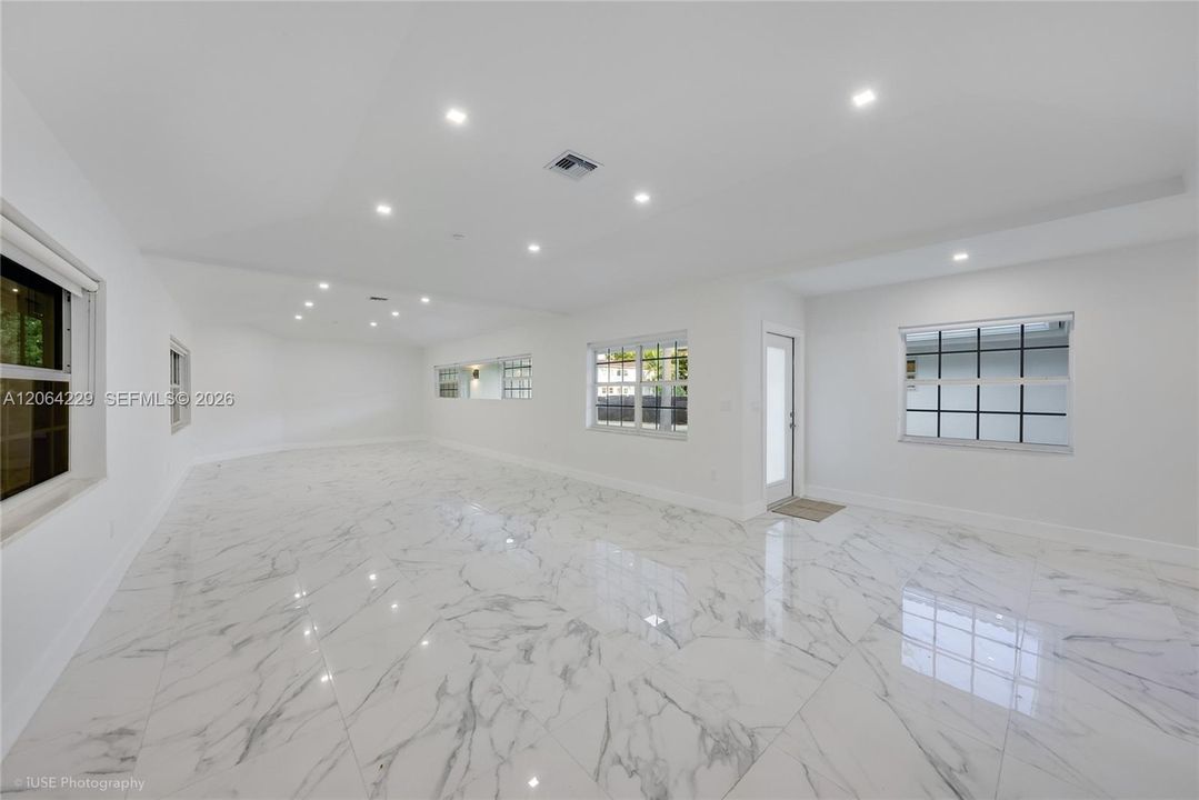 Entrance Door to living room area, dinning and open kitchen