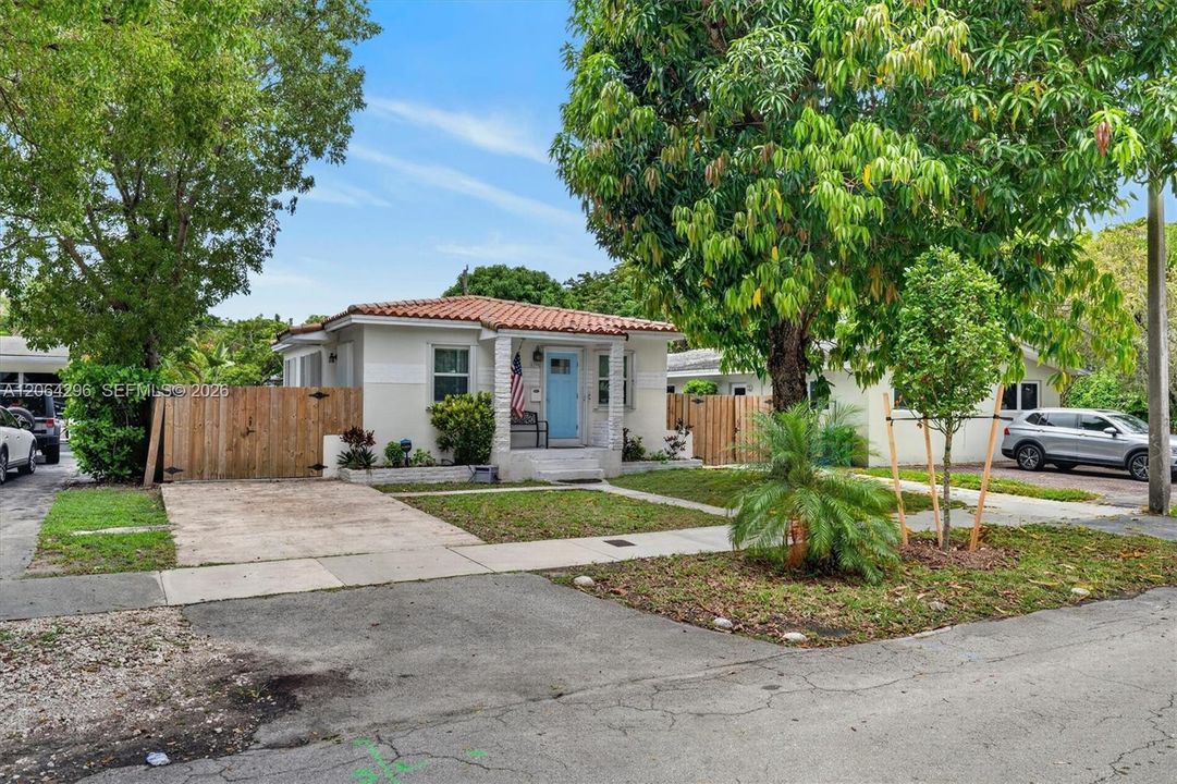 Beautifully landscaped front yard welcomes you home.