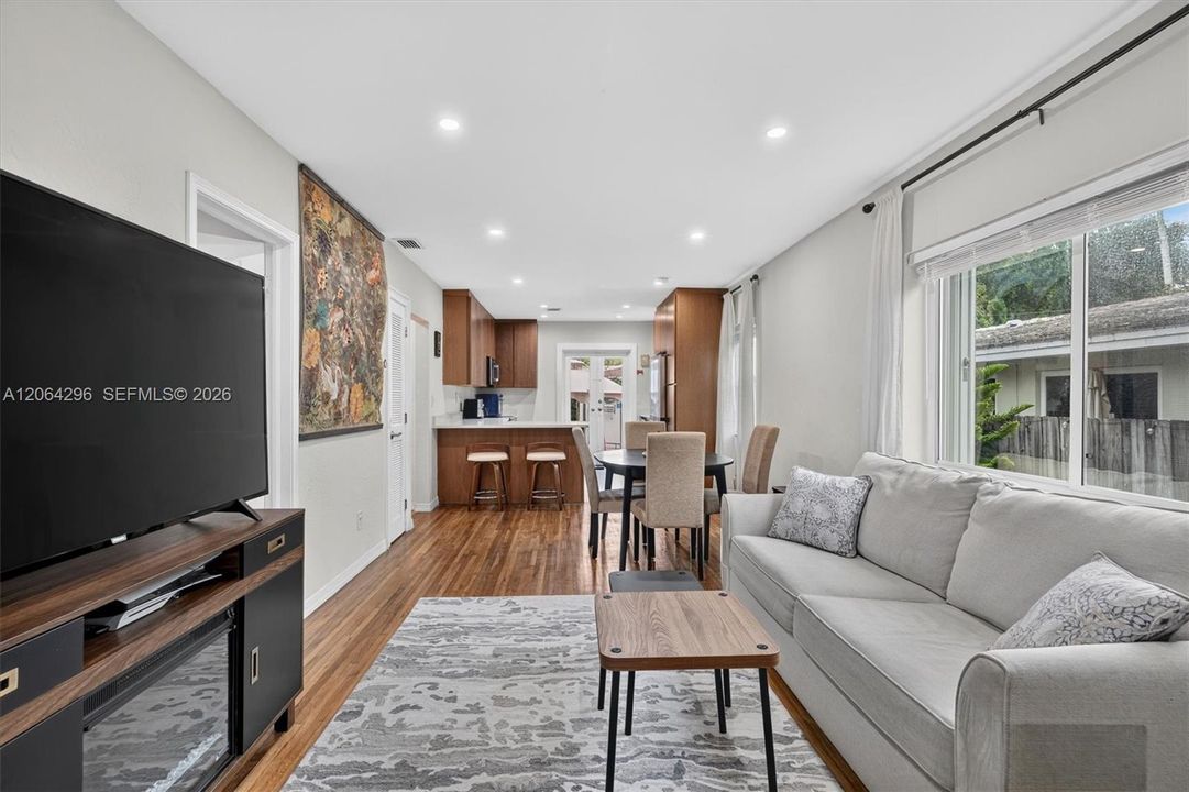 Bright open-concept living area filled with natural light.