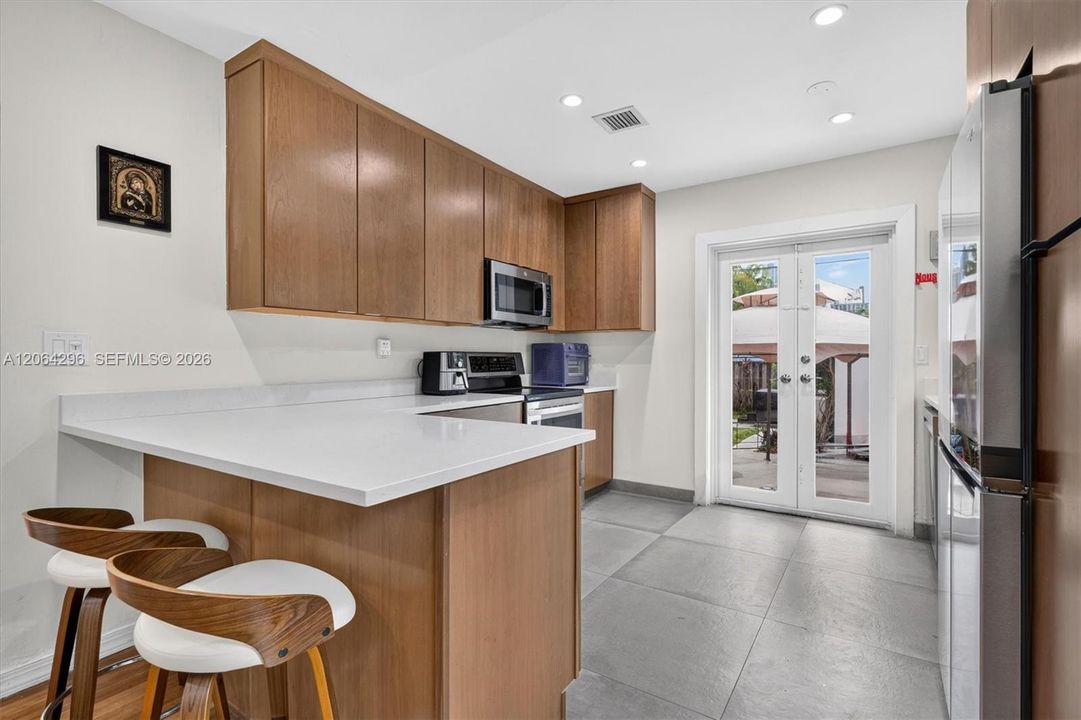 Seamless flow between the kitchen, dining, and living spaces.