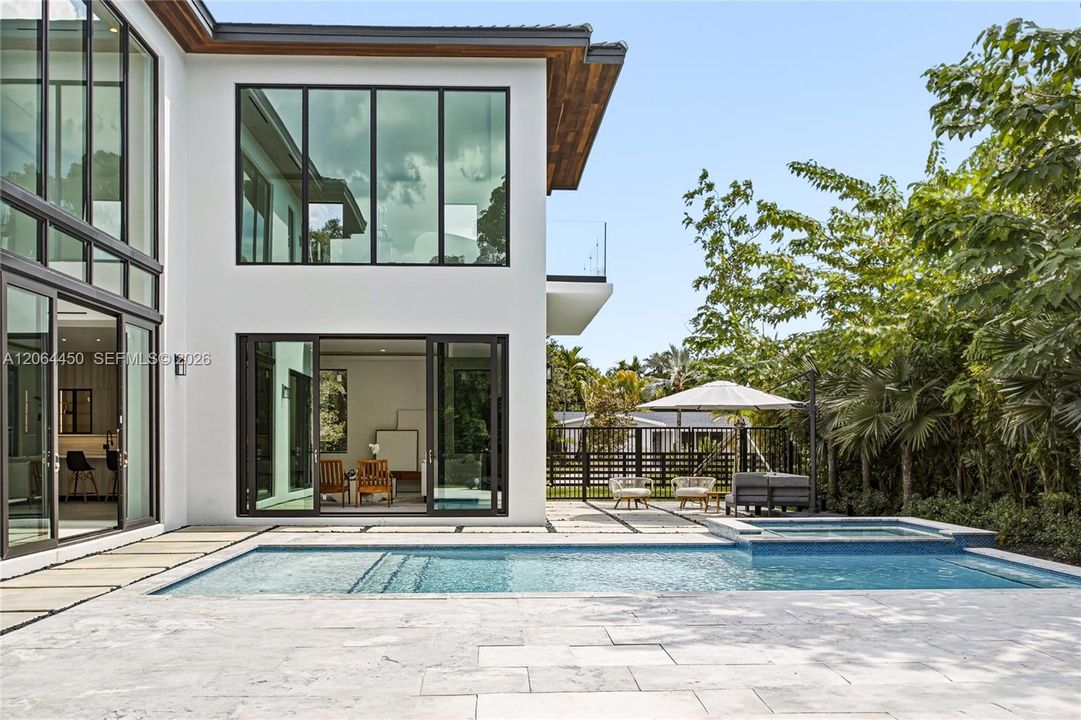 Rear elevation with covered terrace and resort style pool
