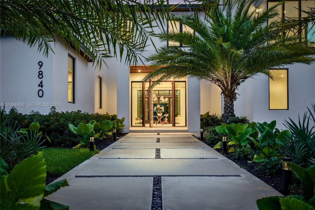 Front Entrance with Elegant Oversized Teak Wood Door